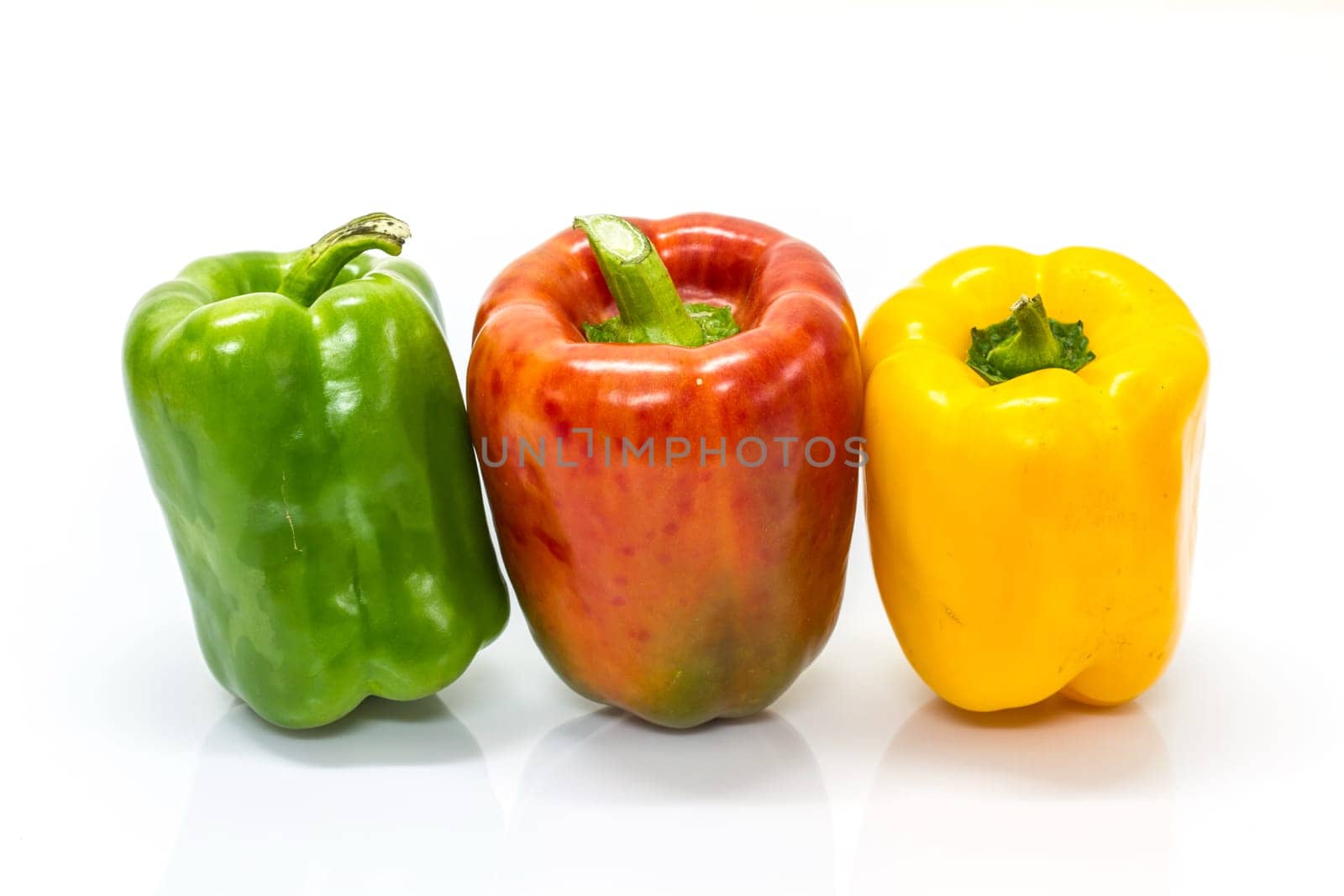 colored peppers over white background, Fresh vegetables sweet Peppers or Bell peppers