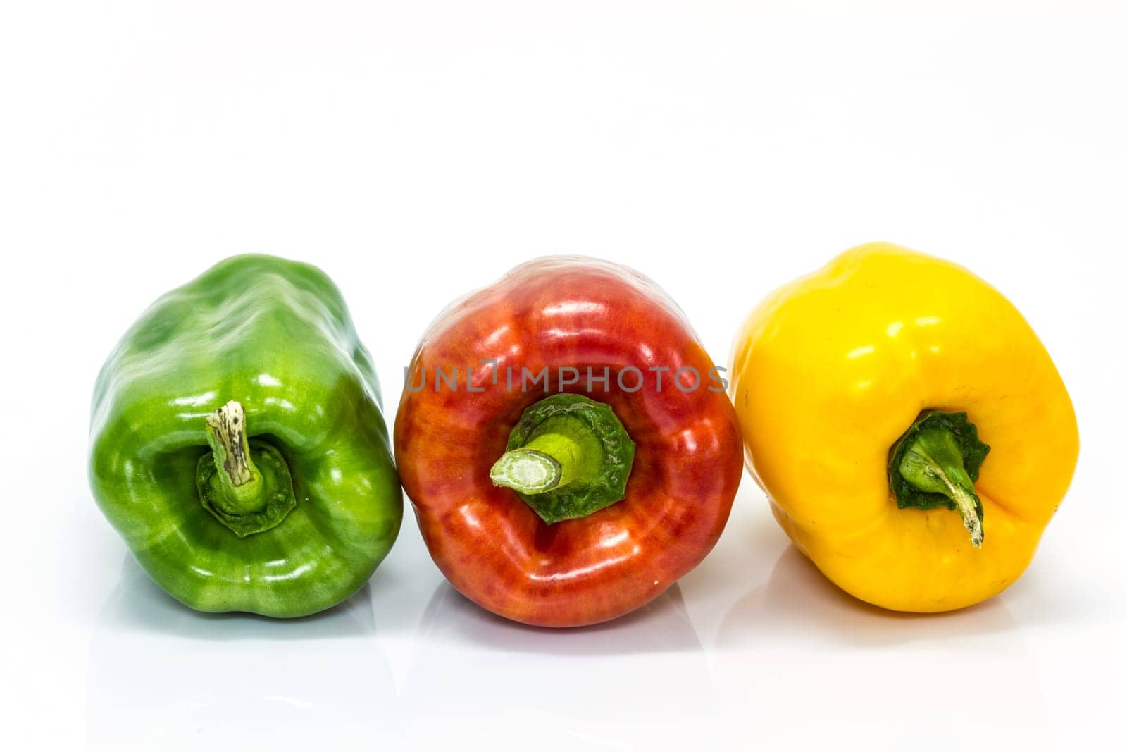colored peppers over white background, Fresh vegetables sweet Peppers or Bell peppers