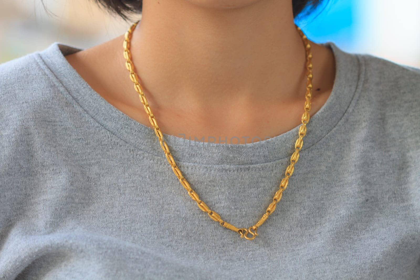 close up Young Woman Wearing Golden Necklace
