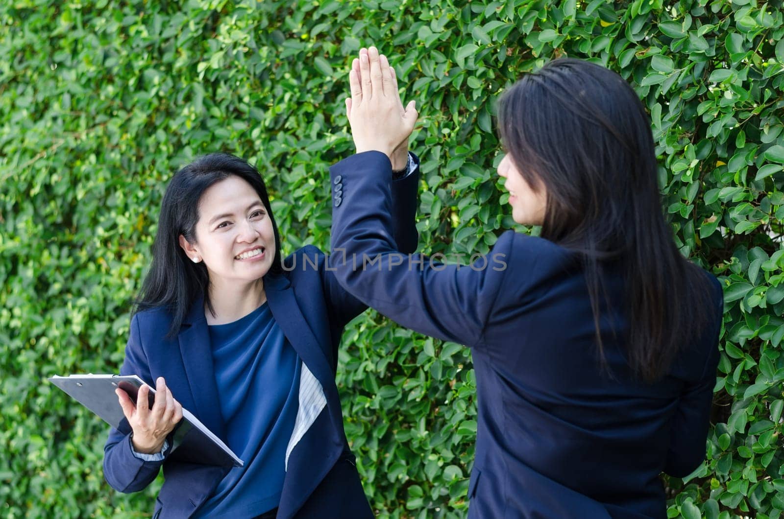 Success business team concept. business women touching hands together with happiness moment.