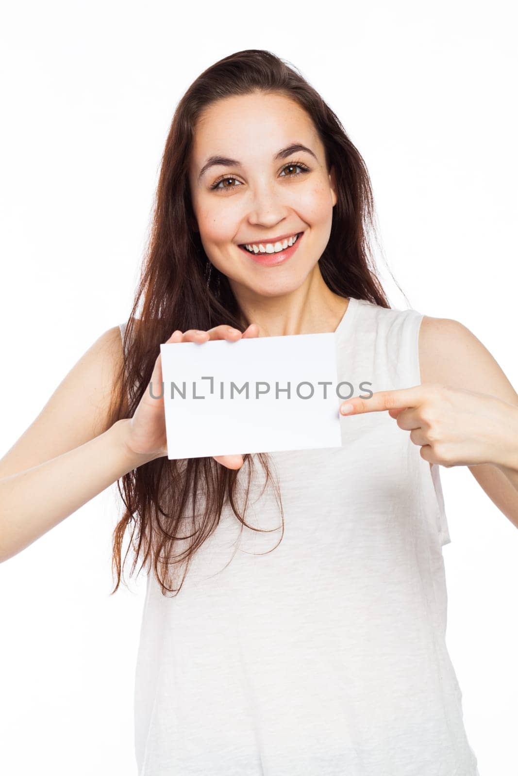 Cheerful woman showing a blank signboard, isolated on white