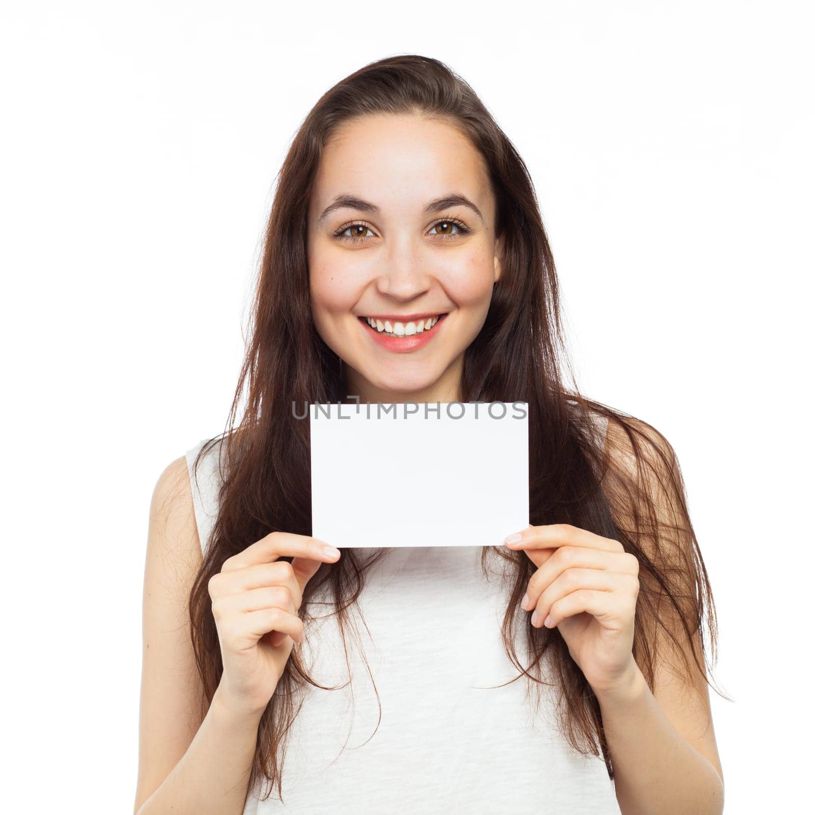 Cheerful young woman showing a blank signboard, isolated on white