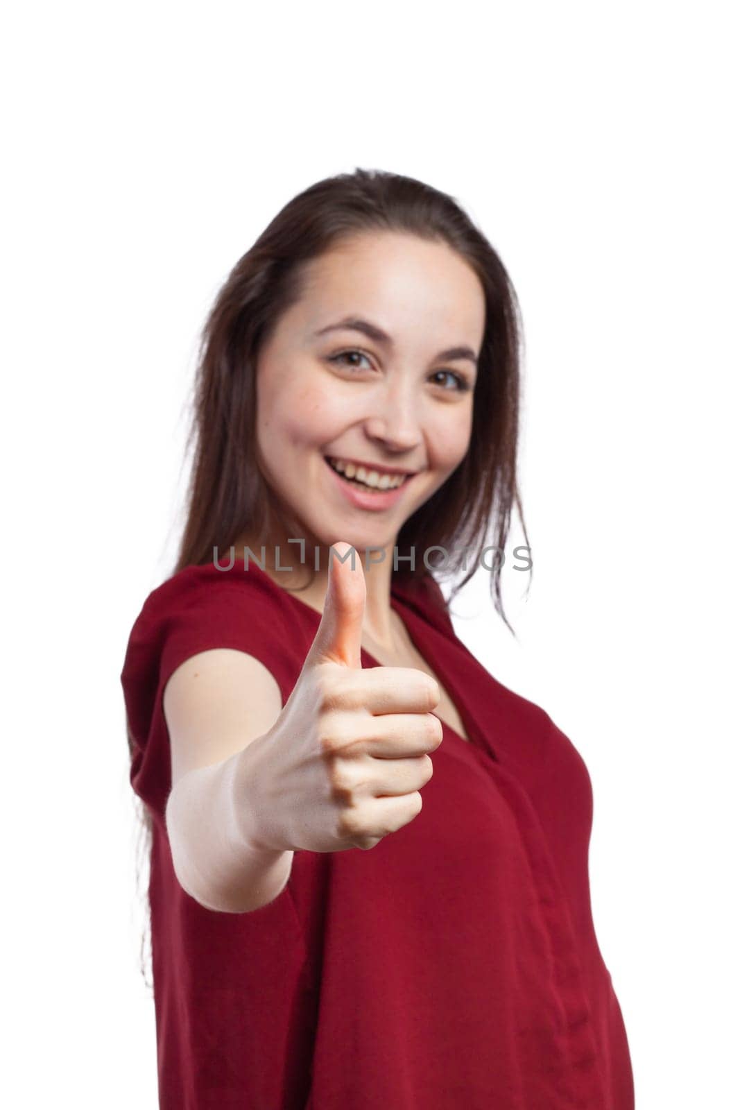 Close up view of the thumb up of a young woman woman, isolated on white