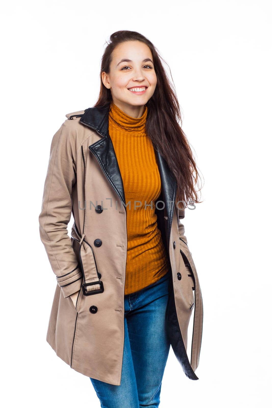 Relaxed and fashionable woman posing, isolated on white