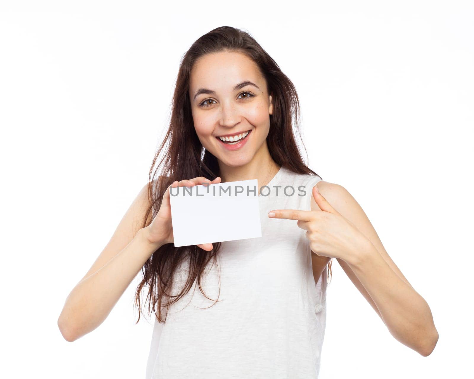 Young woman showing a white signboard, isolated on white