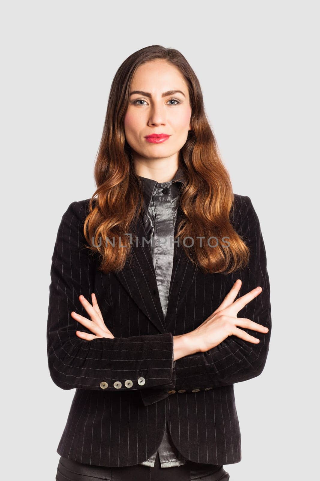 Portrait of a businesswoman, on grey background