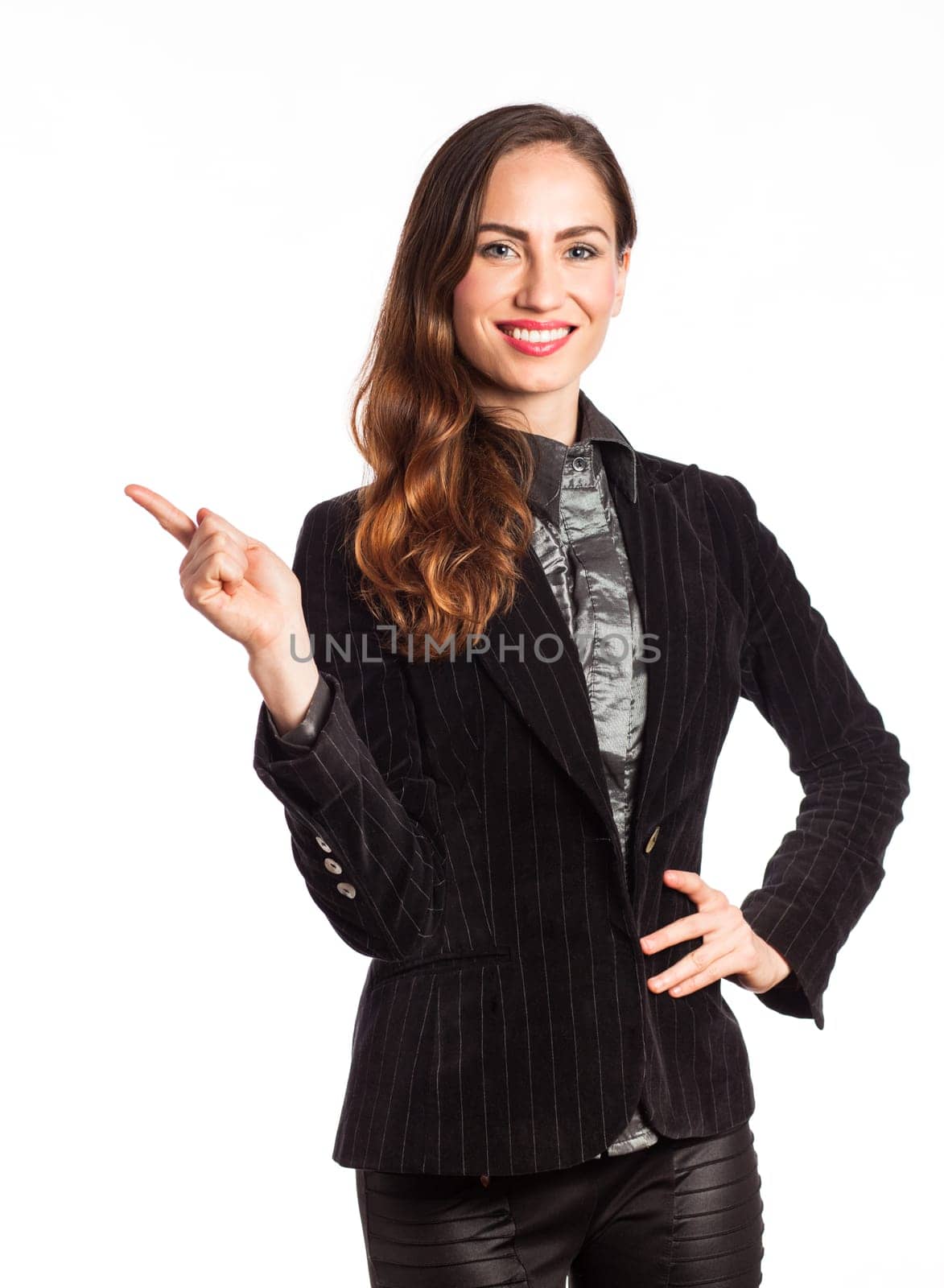 Portrait of an attractive woman pointing up at copy space, isolated on white