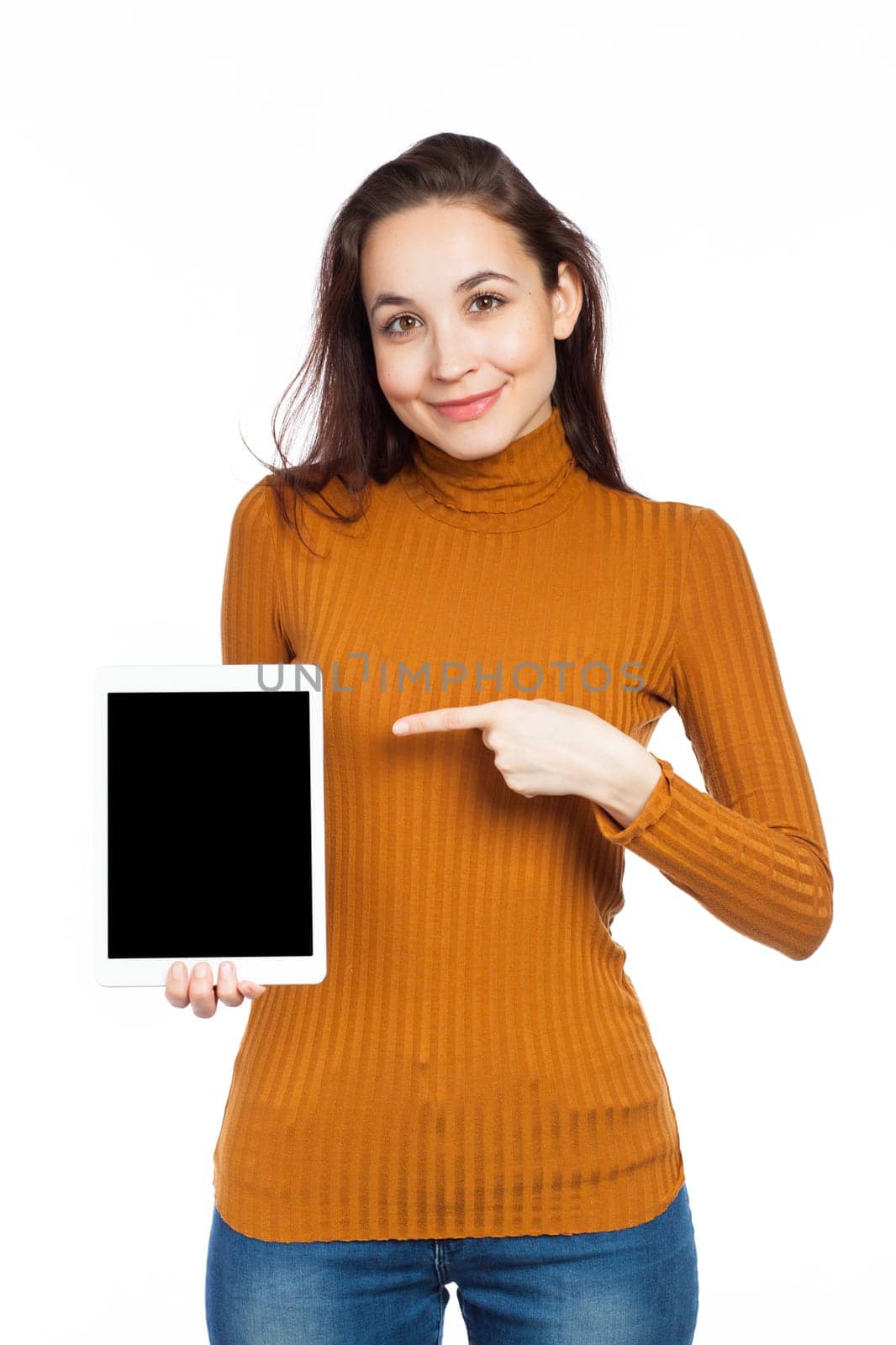 Brunette pointing a blank touchpad, isolated on white