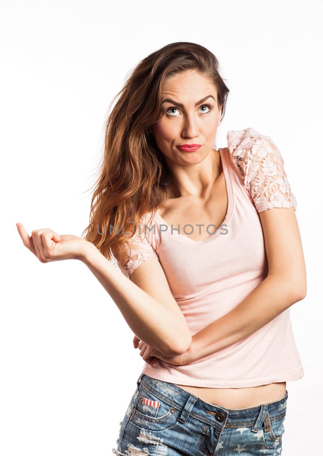 Portrait of a sexy girl having a funny face, isolated on white