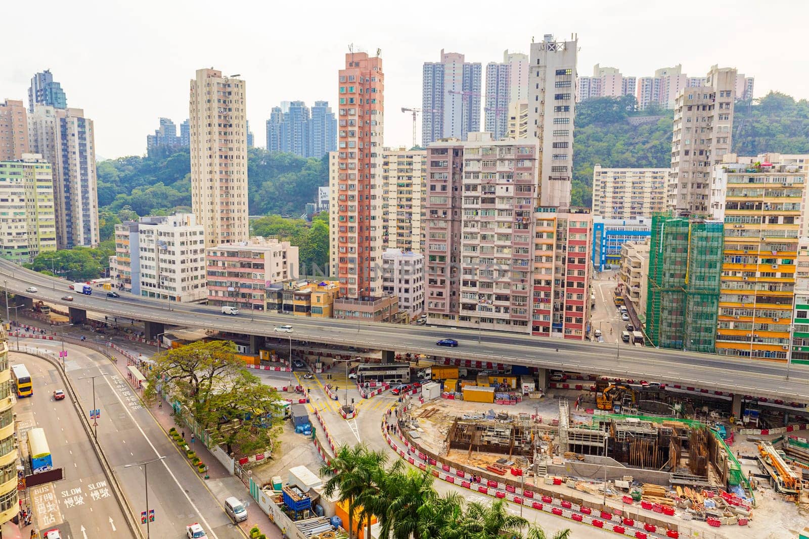 Old houses surrounded modern skyscrapers in Hong Kong. Hong Kong is popular tourist destination of Asia and leading financial centre of the world.