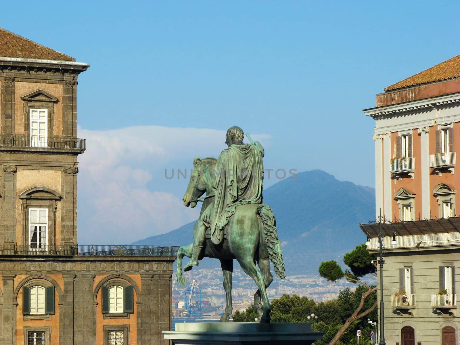 Statua di Carlo III di Spagna (Carlo Sebastiano di Borbone, Carlos Sebastián de Borbón y Farnesio, Charles III of Spain) with part of the Vesuvius volcano in the background