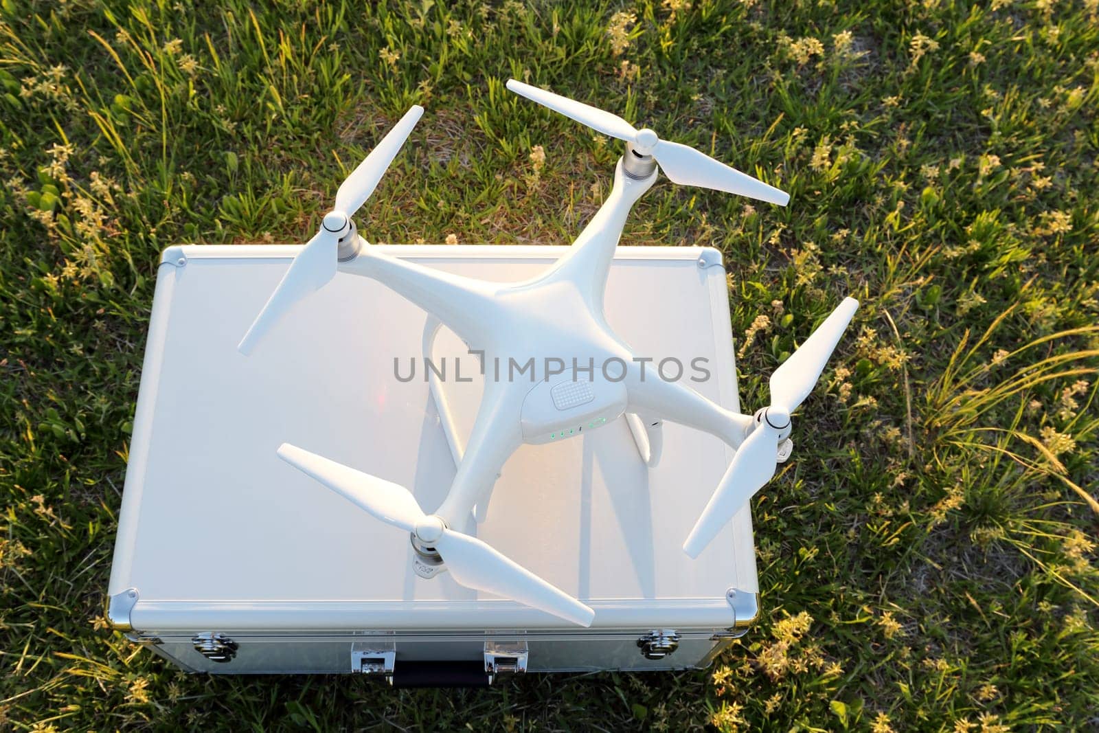 KAGAWA, JAPAN - APRIL 23, 2017: White drone Dji Phantom4Pro stay on metal bag and ready to fly.