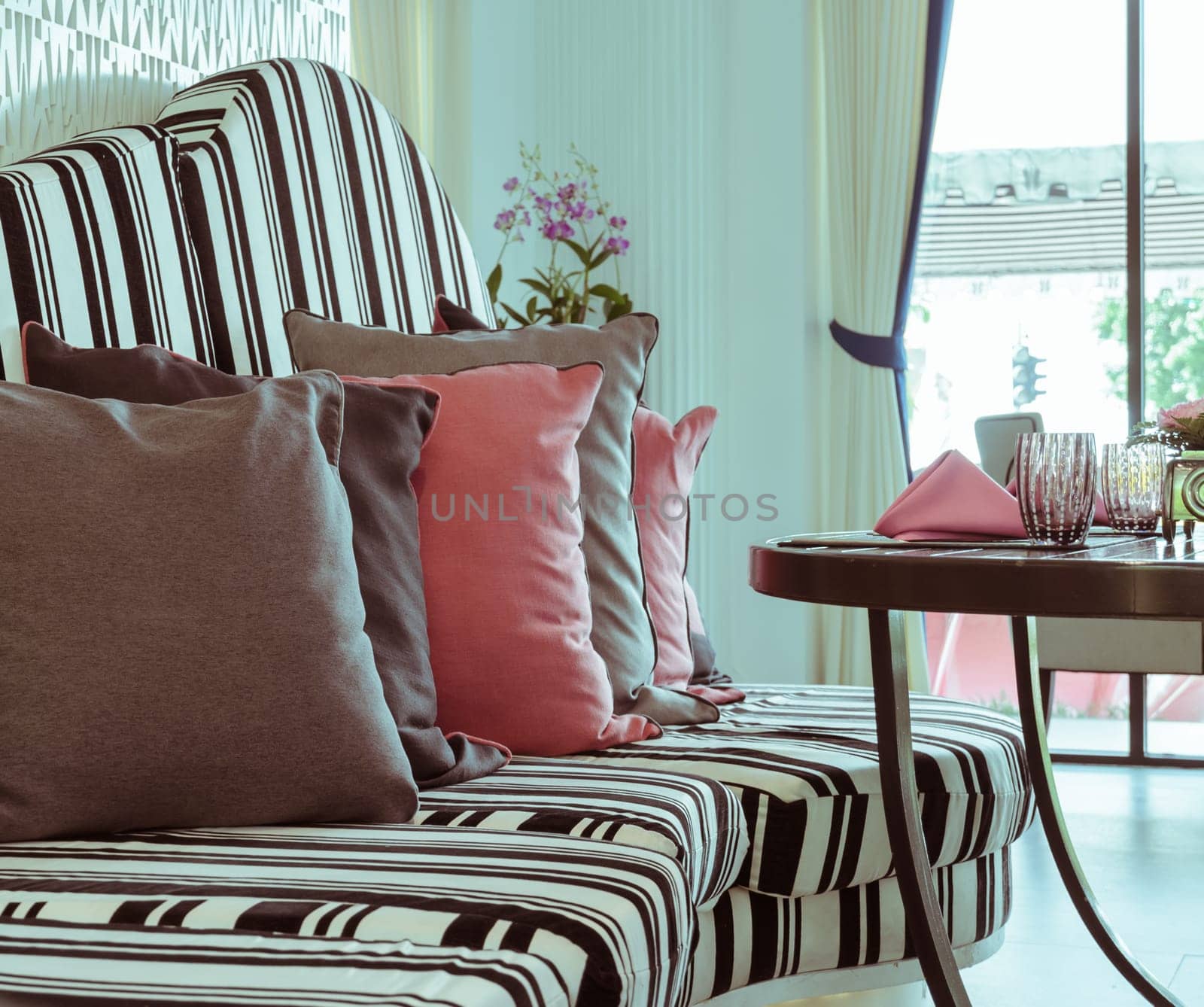 Table and Sofa with pillows, vintage filtered effect image