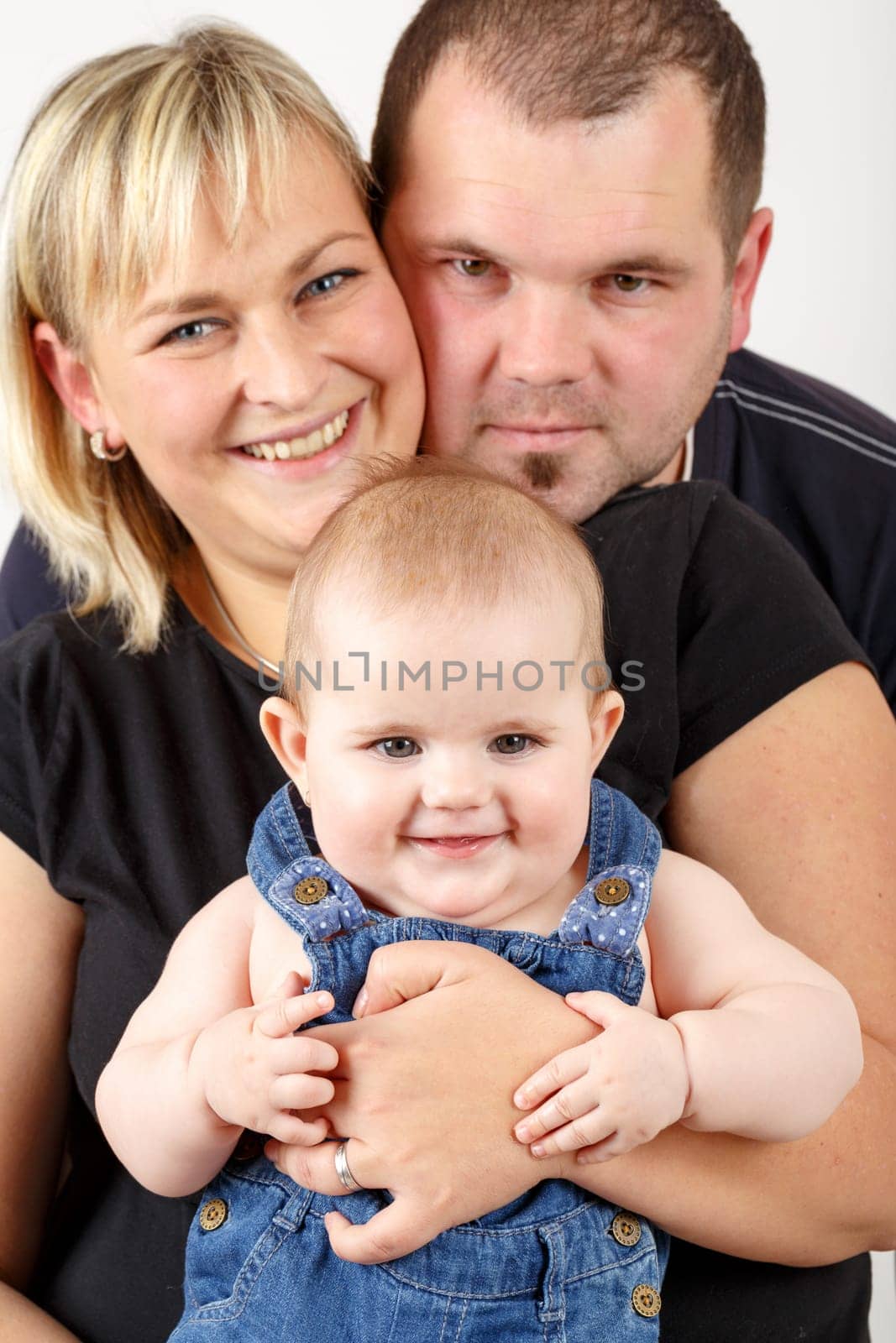 mother and father with her cute little baby girl, first year of the new life