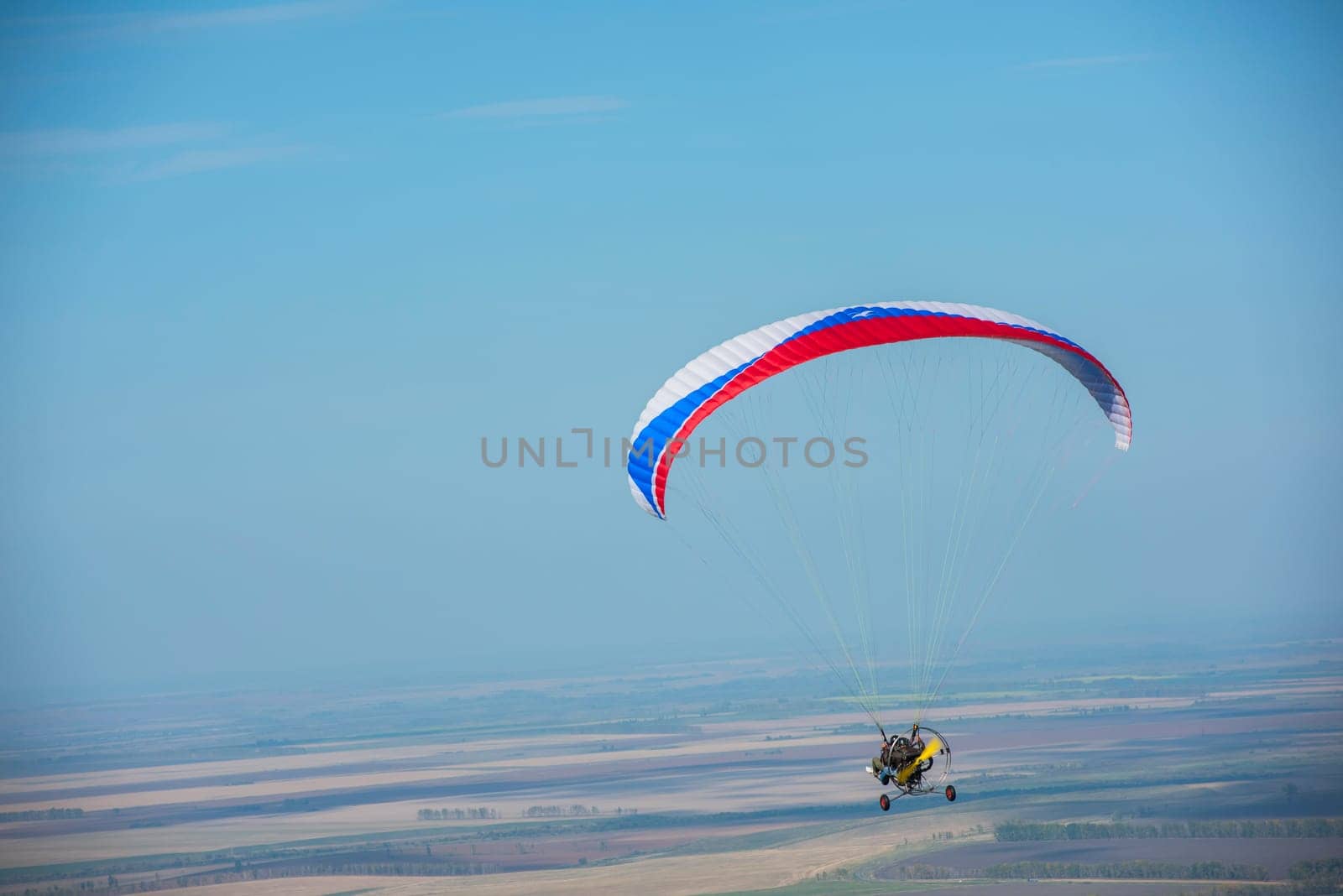 Paragliding in mountains. Para gliders in fight in the mountains, extreme sport activity.