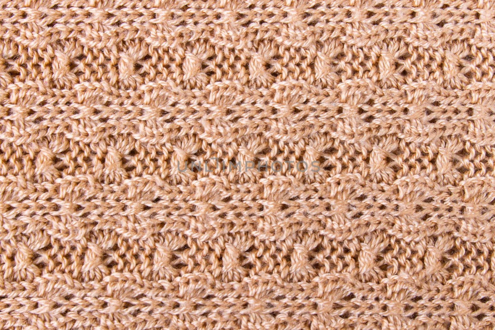 Brown knitting fabric texture background or knitted pattern background. Knitting or knitted background.