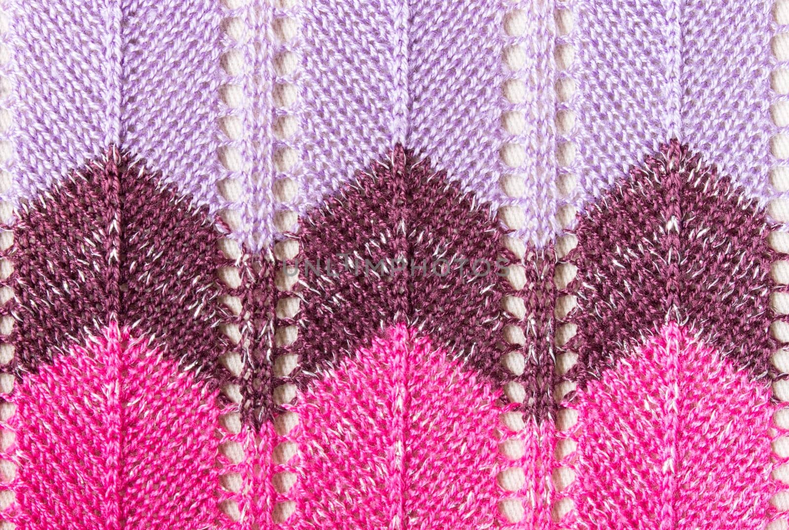 Vertical purple pink knitting fabric texture background or knitted pattern background for design. Knitting or knitted