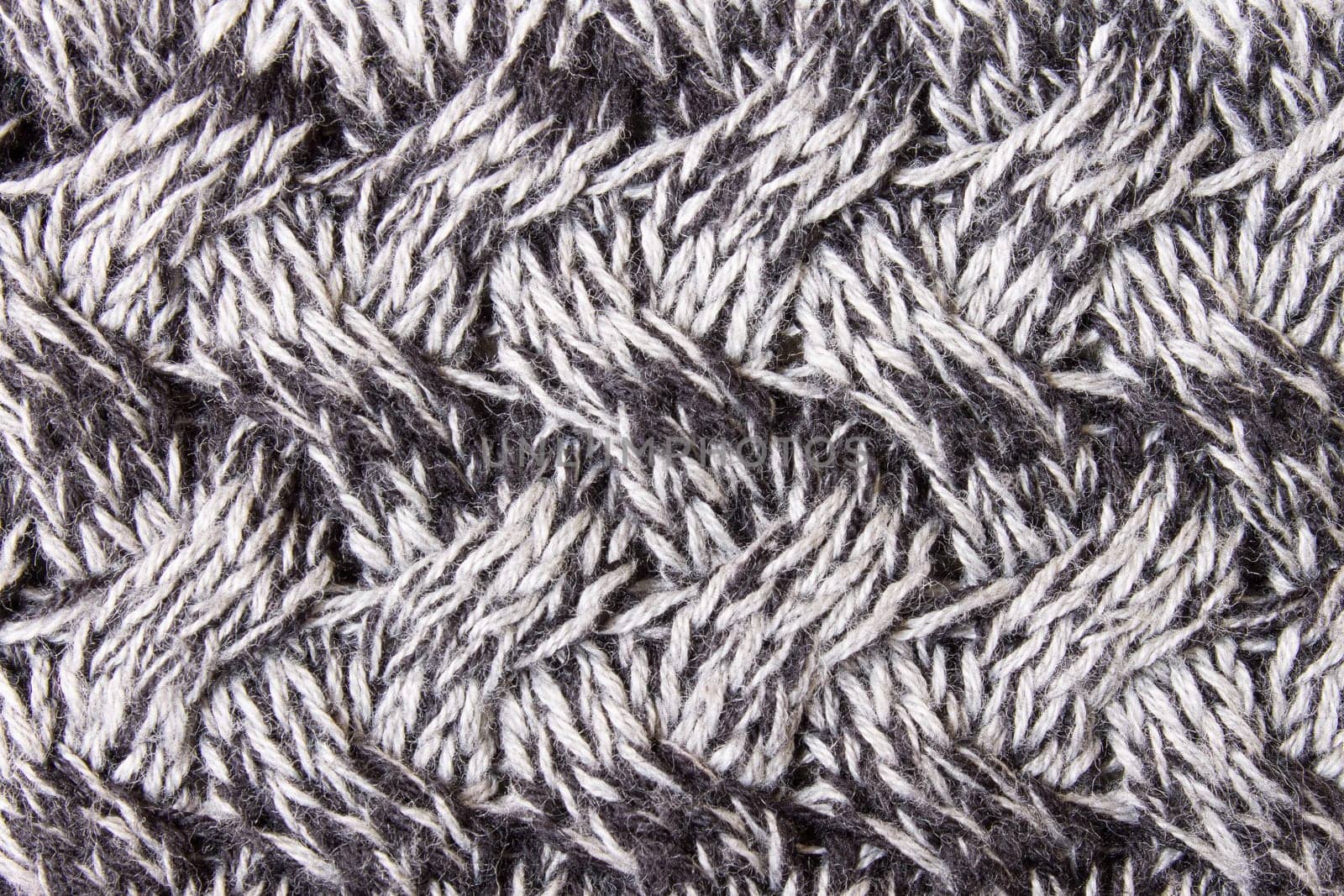 Black and white knitting fabric texture background or knitted pattern background. Knitting or knitted background close up view.
