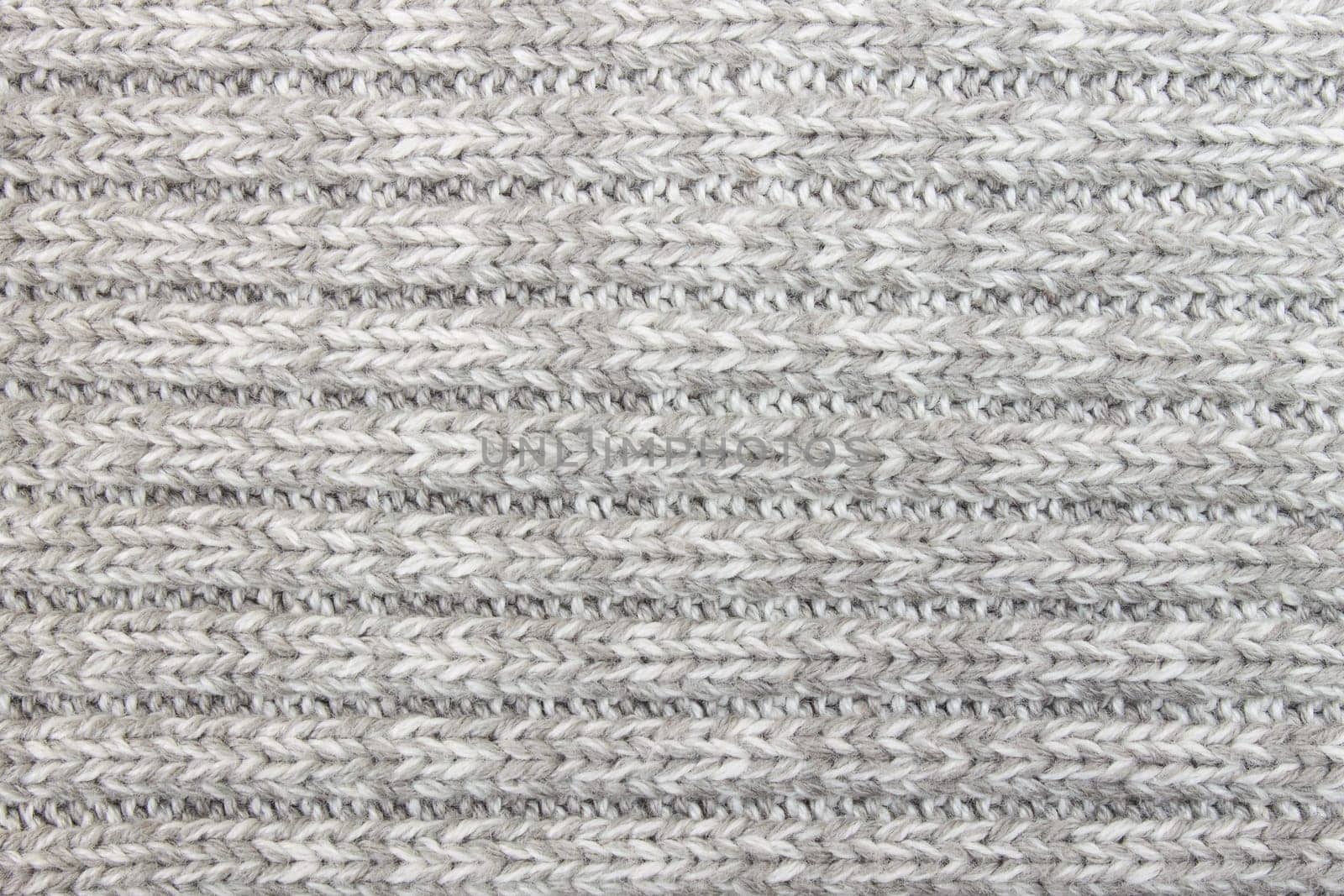 Horizontal gray knitting fabric texture background or knitted pattern background. Knitting or knitted background for design.
