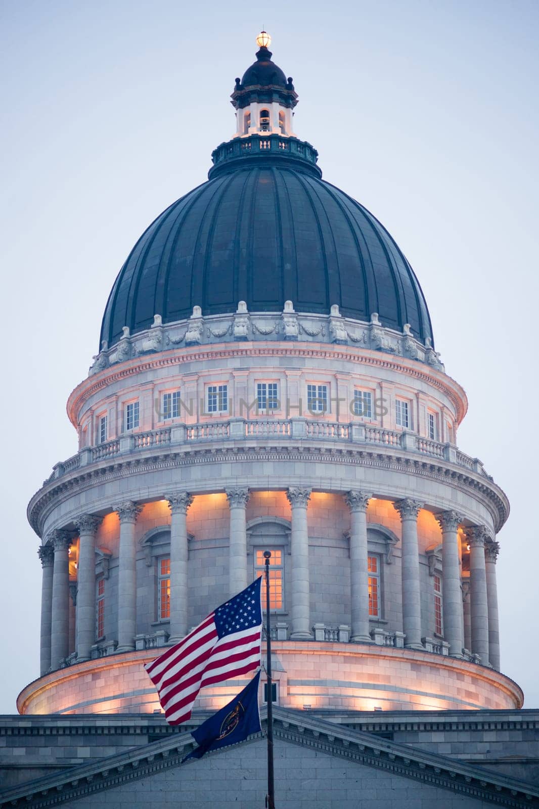 The US and Utah Flags fly in front of the State Capital in Salt Lake City