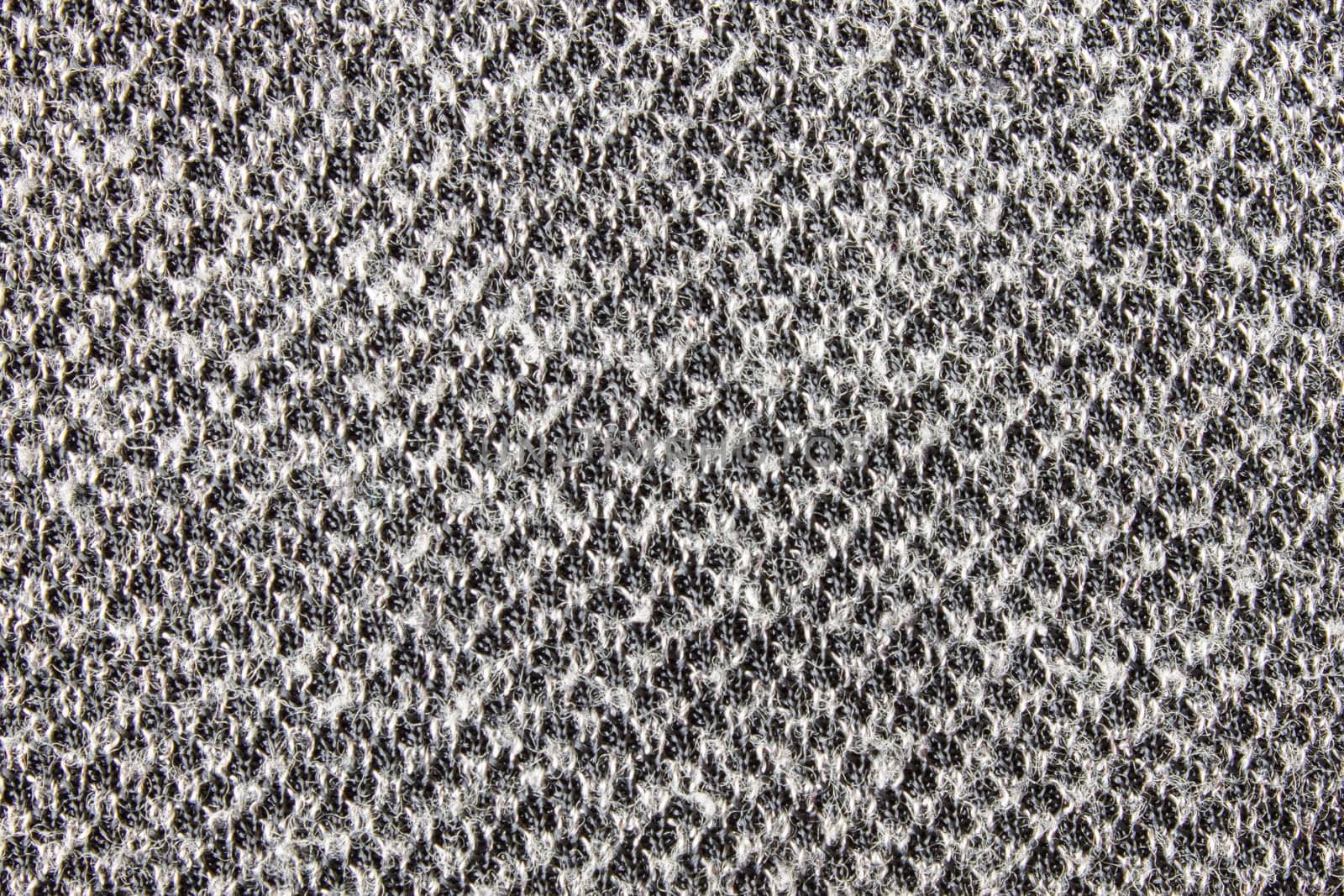Black and white knitting fabric texture background or knitted pattern background. Knitting or knitted background.