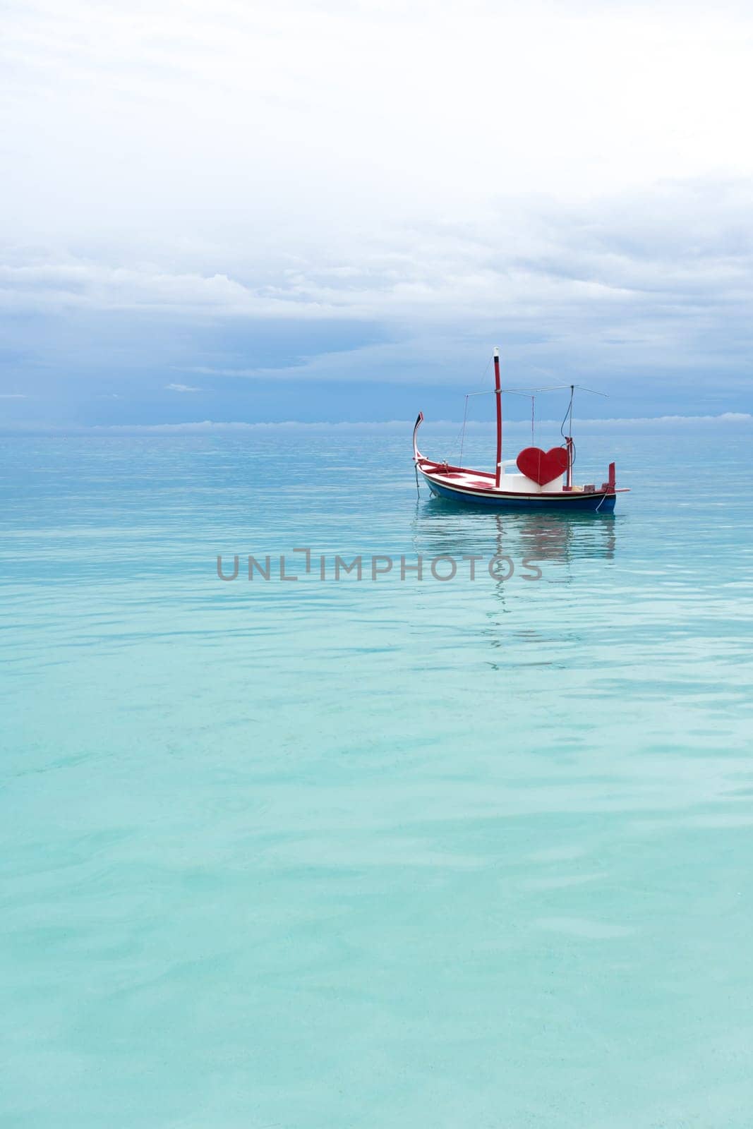 boat with red heart in the ocean