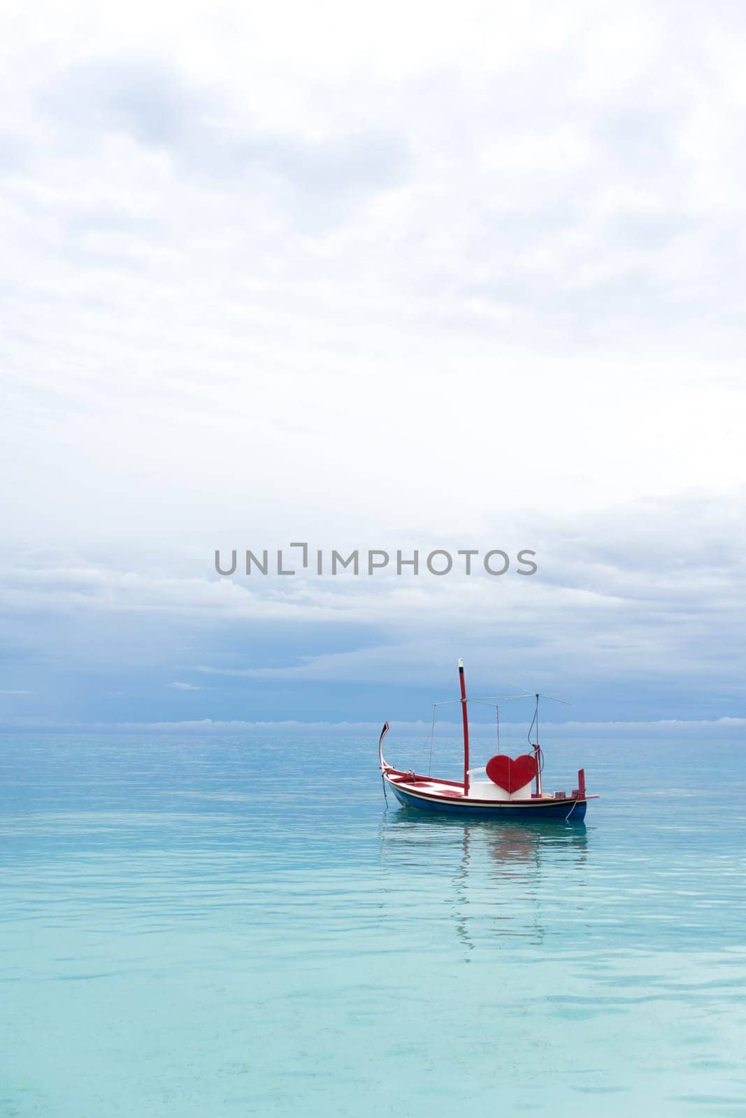 boat with red heart in the ocean