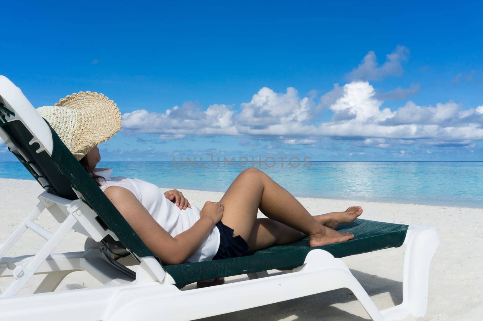 Woman in relaxation on tropical beach in holiday