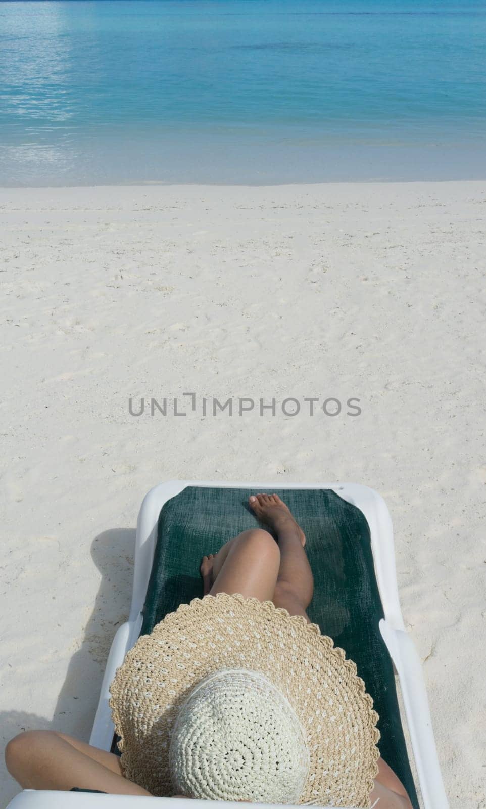Woman in relaxation on tropical beach in holiday