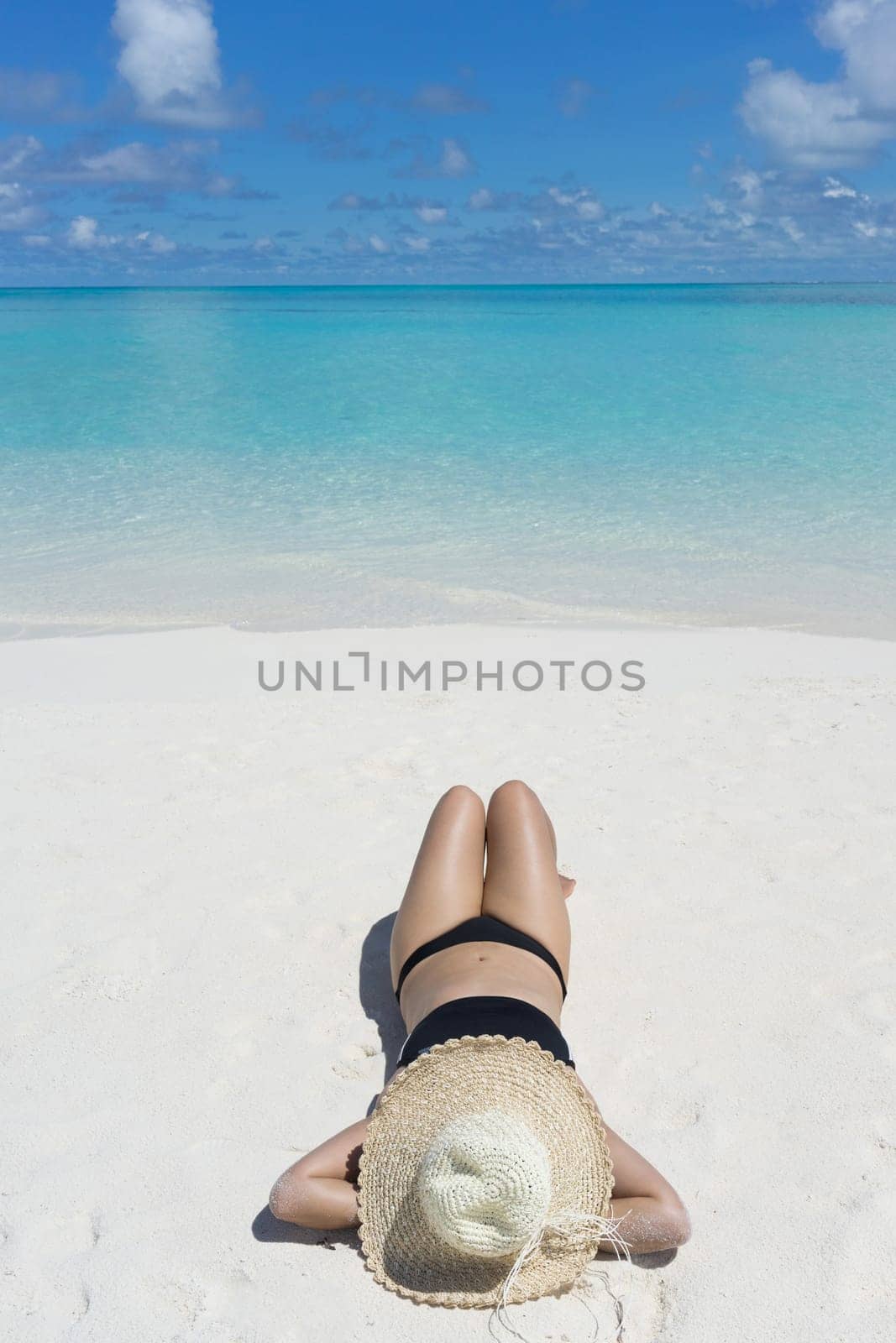 Woman in relaxation on tropical beach in holiday