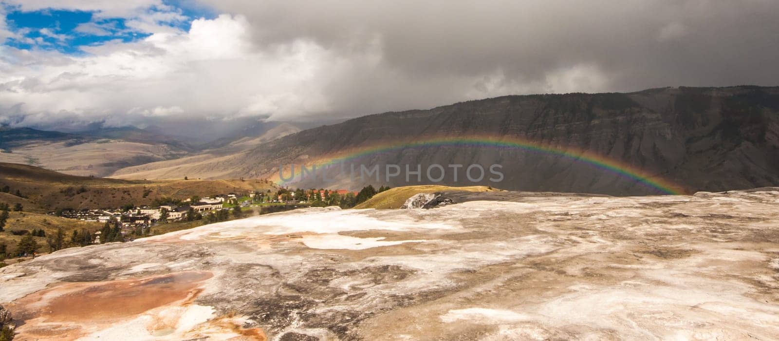 Landscape of a rainbow across Mt. Everts at Mammoth Springs, Wyoming, USA.