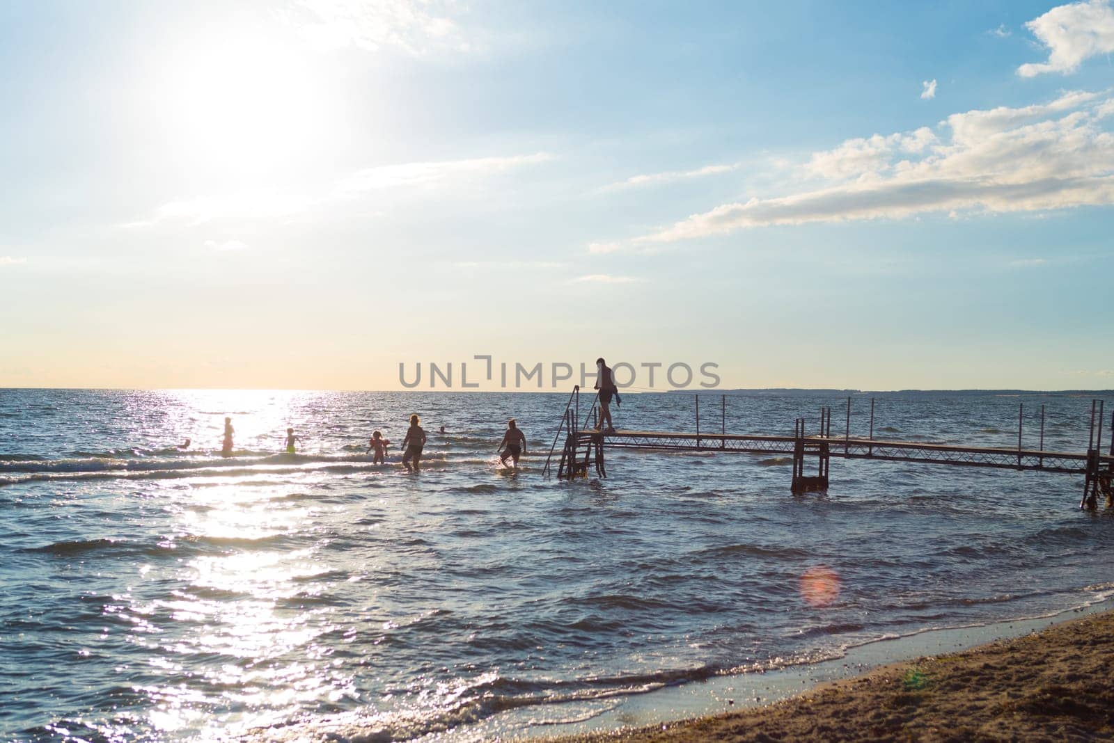 family with children having fun on a danish beach