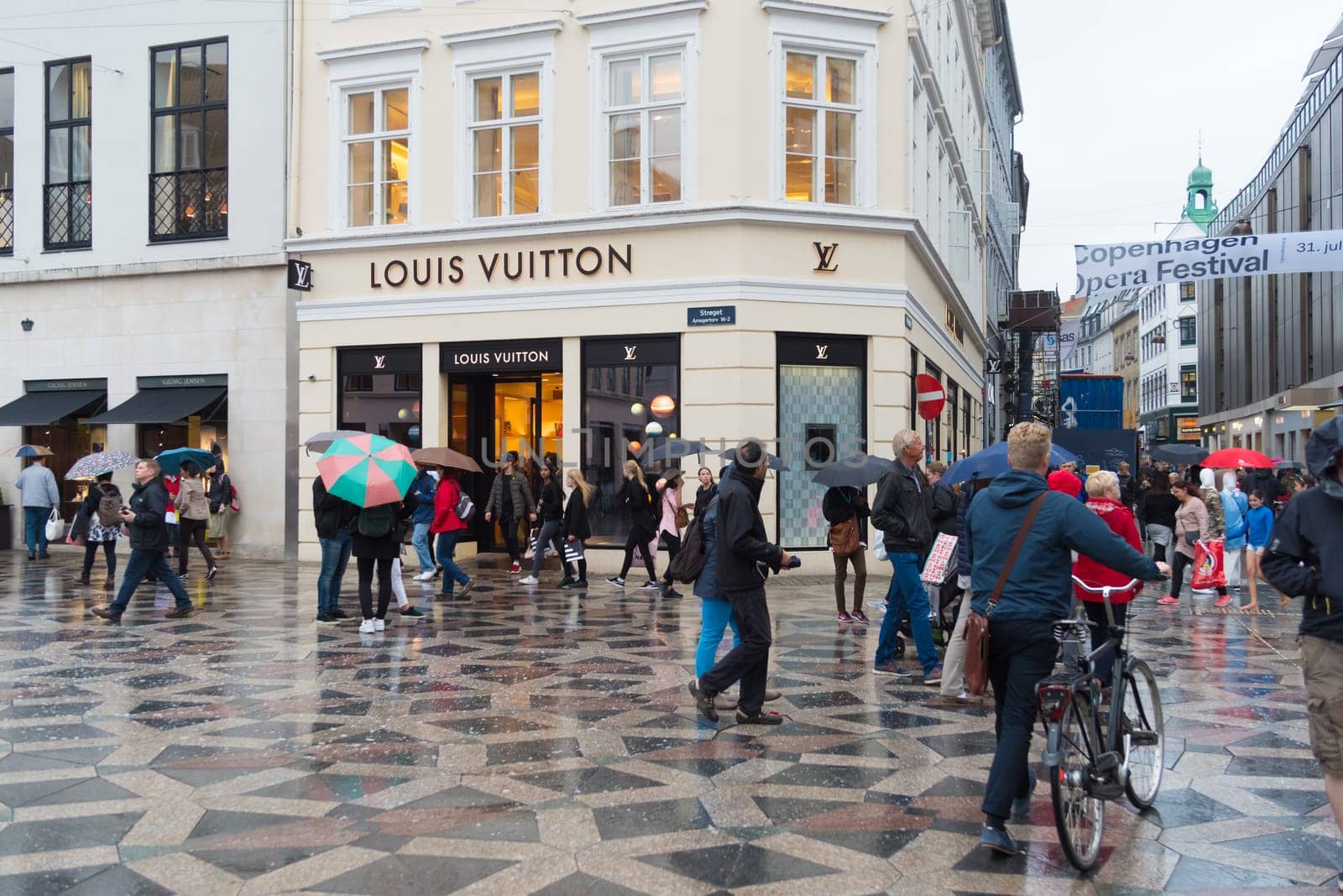 COPENHAGEN, DENMARK - AUGUST 3, 2016: Pedestrian zone in the center of the city on a rainy day