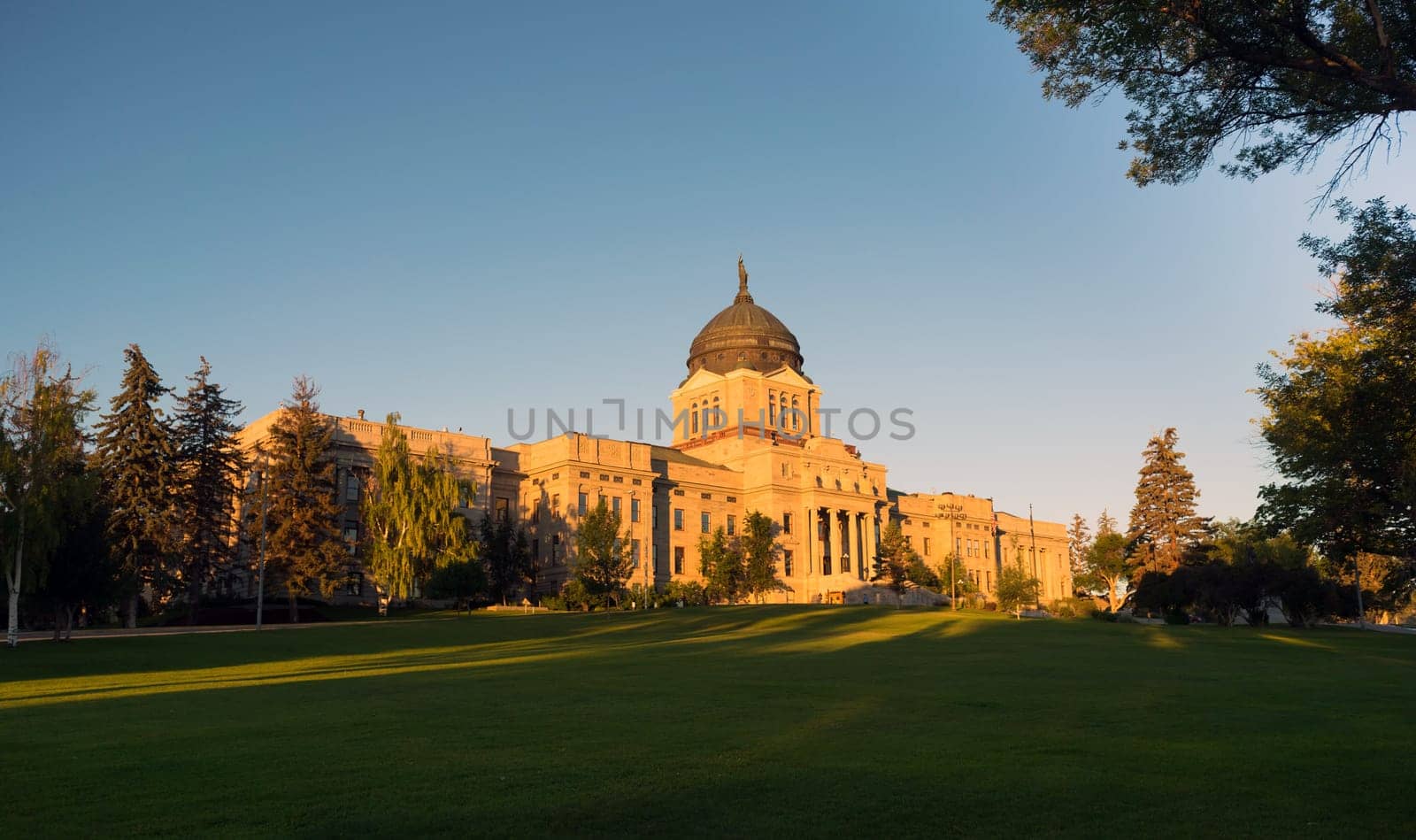 The sun hits the capital building in Helena just after sunrise