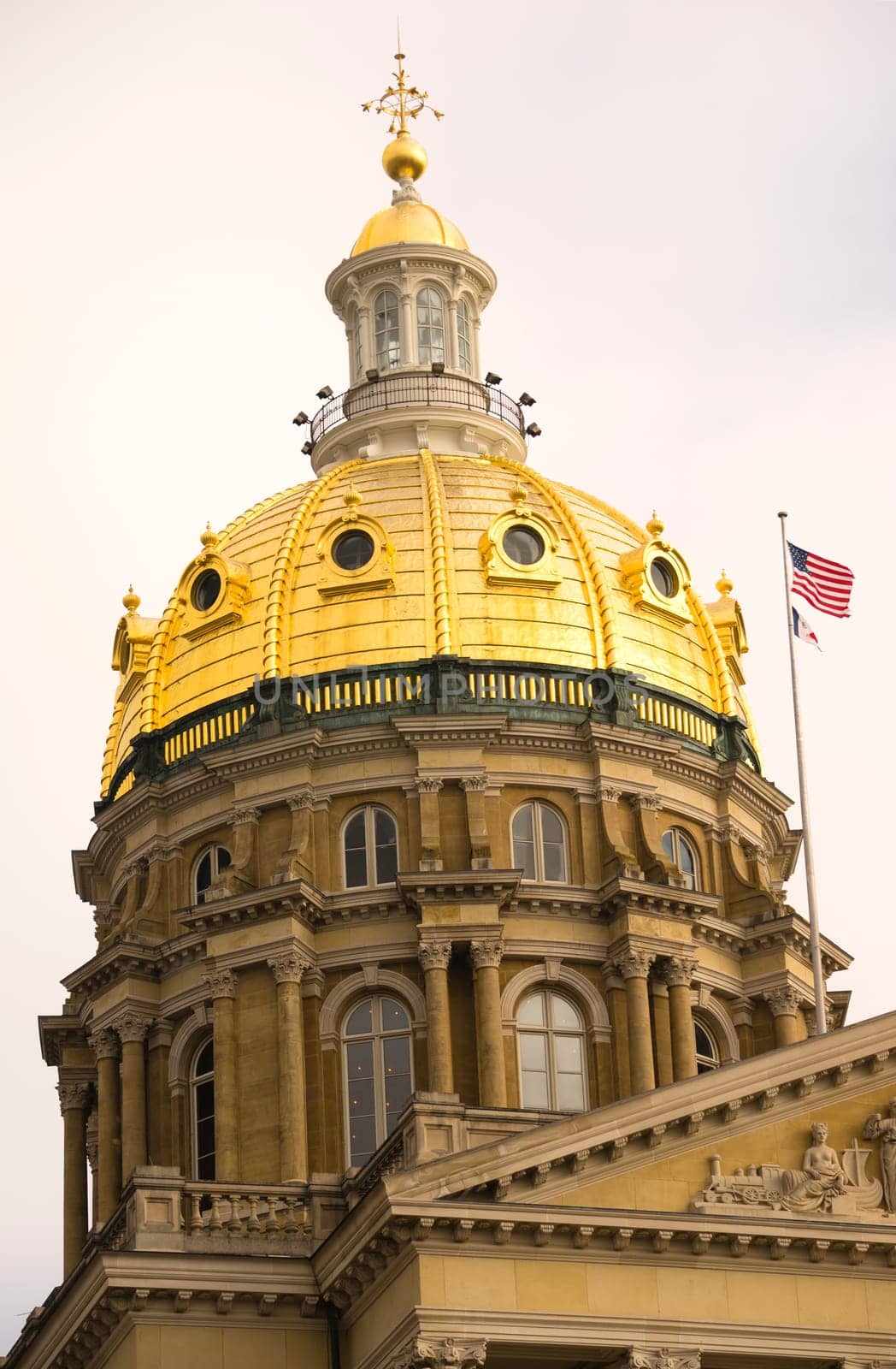 The US and State flags fly at Des Moines Capital