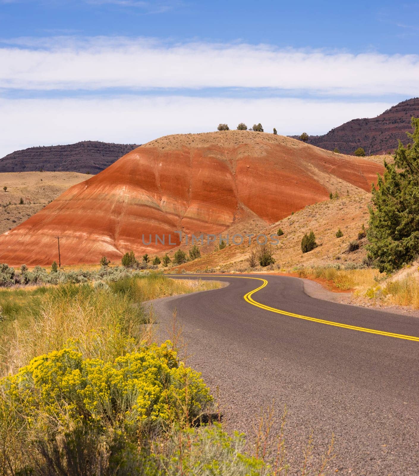 The road winds through colorful mineral and rock deposits in Oregon