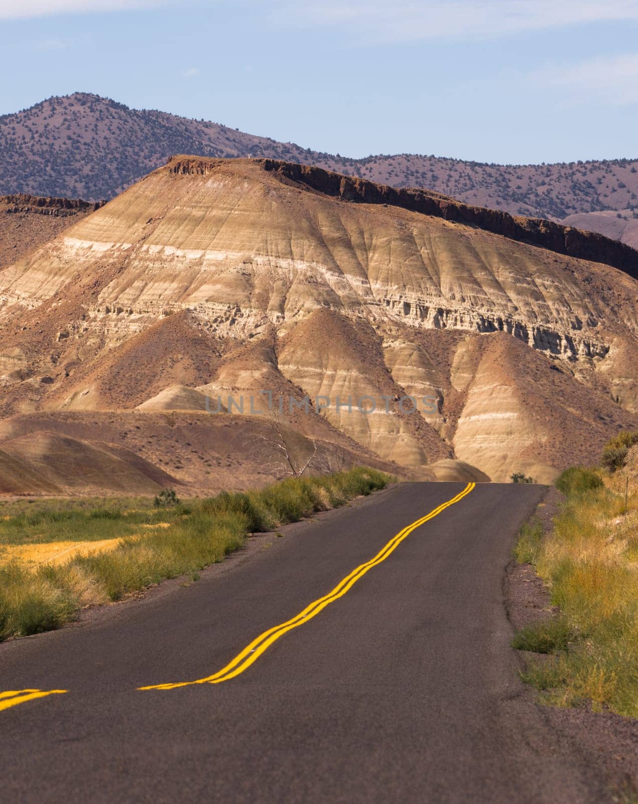 The road winds through colorful mineral and rock deposits in Oregon