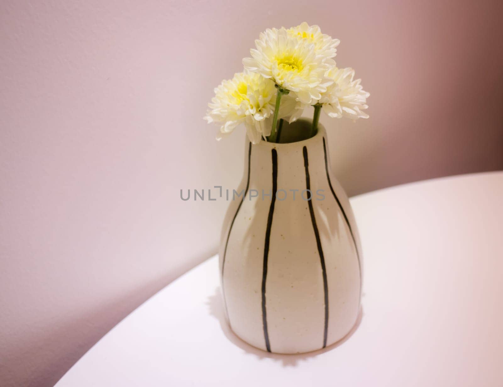 White Flowers Vase Decorated On Table, stock photo