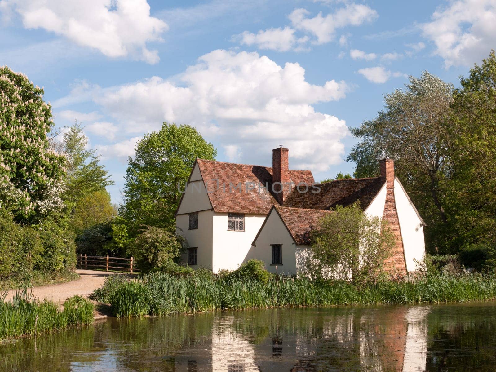 Willy Lott's Cottage outside in flatford mill in constable country old and famous location building from a painting on a summer afternoon with no people very beautiful