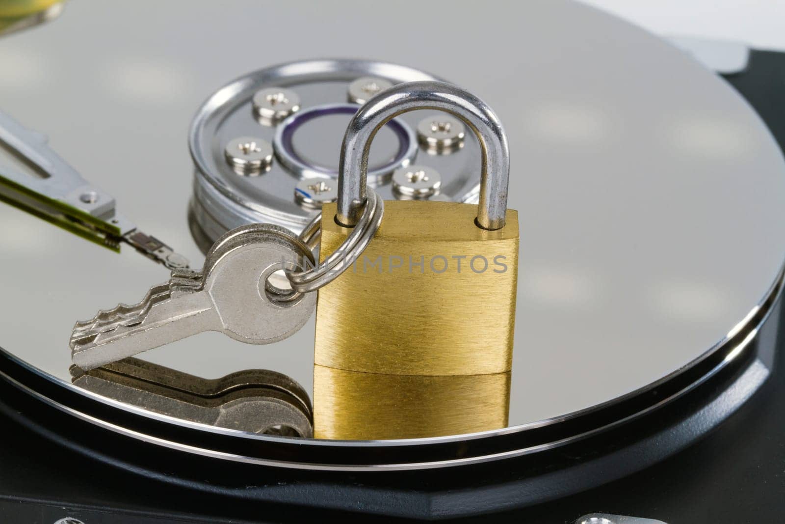 Geo-opened hard drive with small padlock in detail