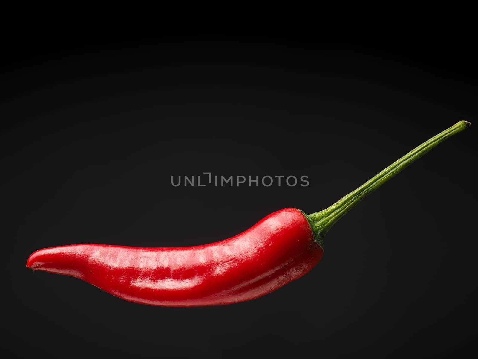 Close up of a red hot pepperoni, spicy ingredients, space for text