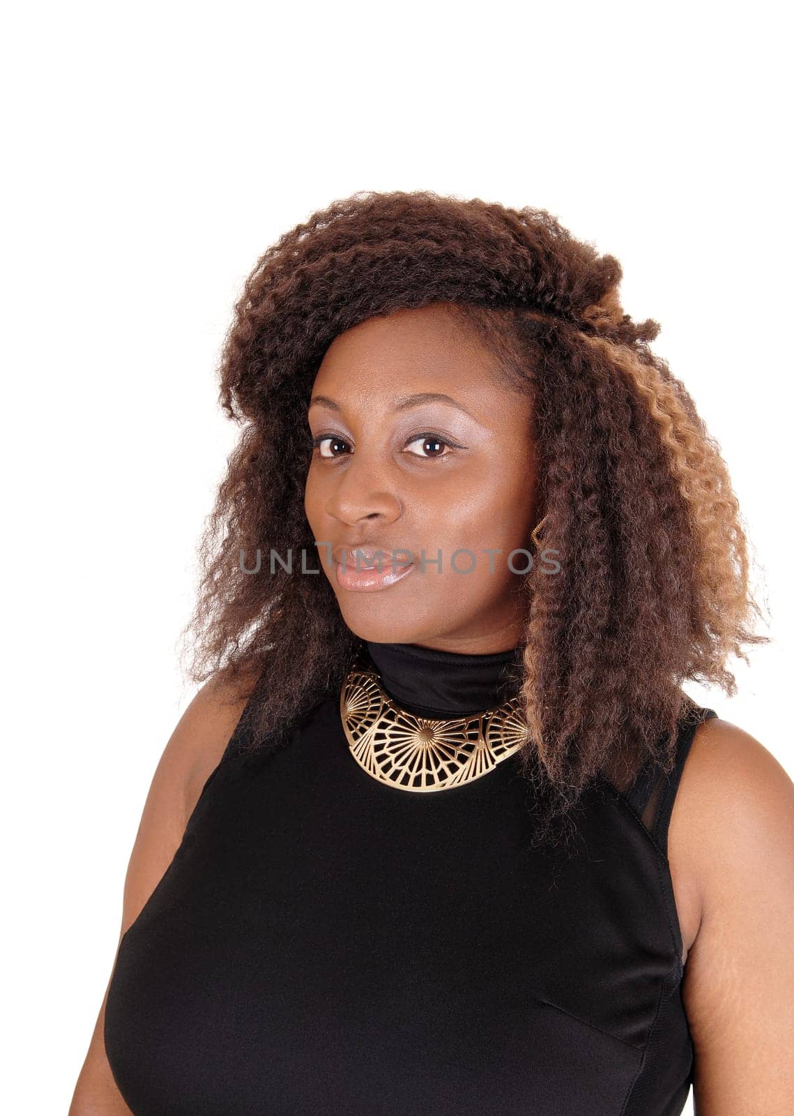 A head shoot of a young African American woman in a black dress, .with a gold necklace and frizzy hair, isolated on white background..