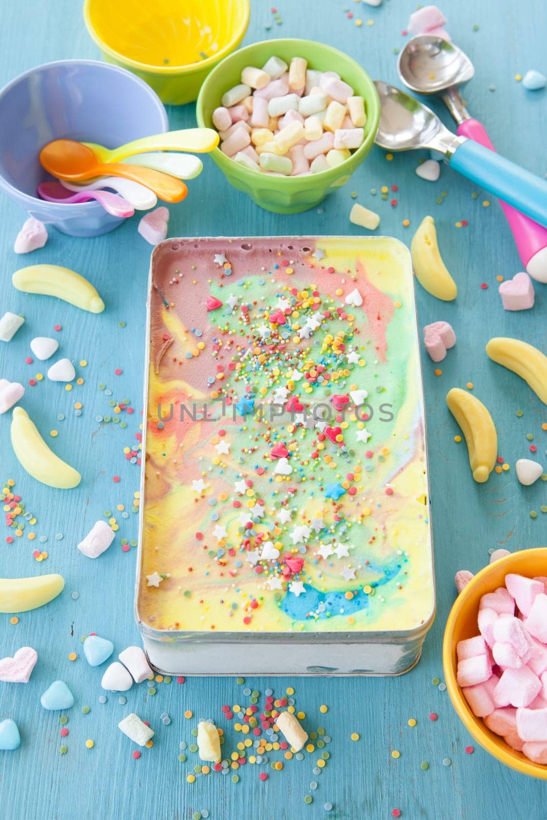 Colorful ice cream with sugar sprinkles and marshmallows