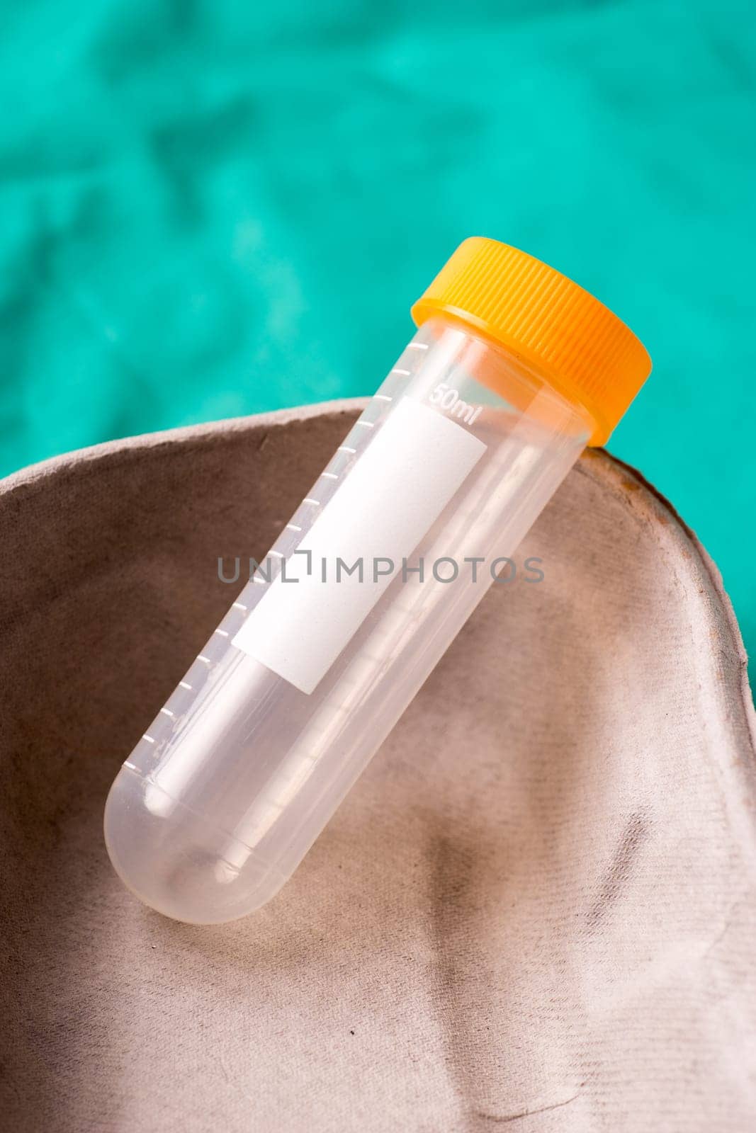 Medical Stethoscope lying on the hospital's green background. The background can be a textile part of a doctor or nurse's work uniform