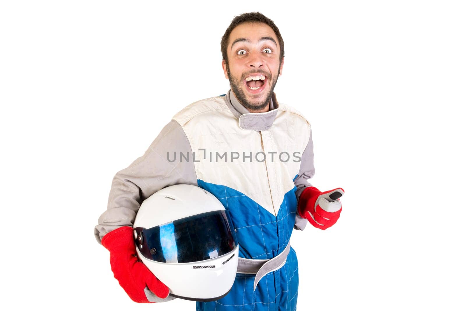Racing driver posing with helmet isolated in white