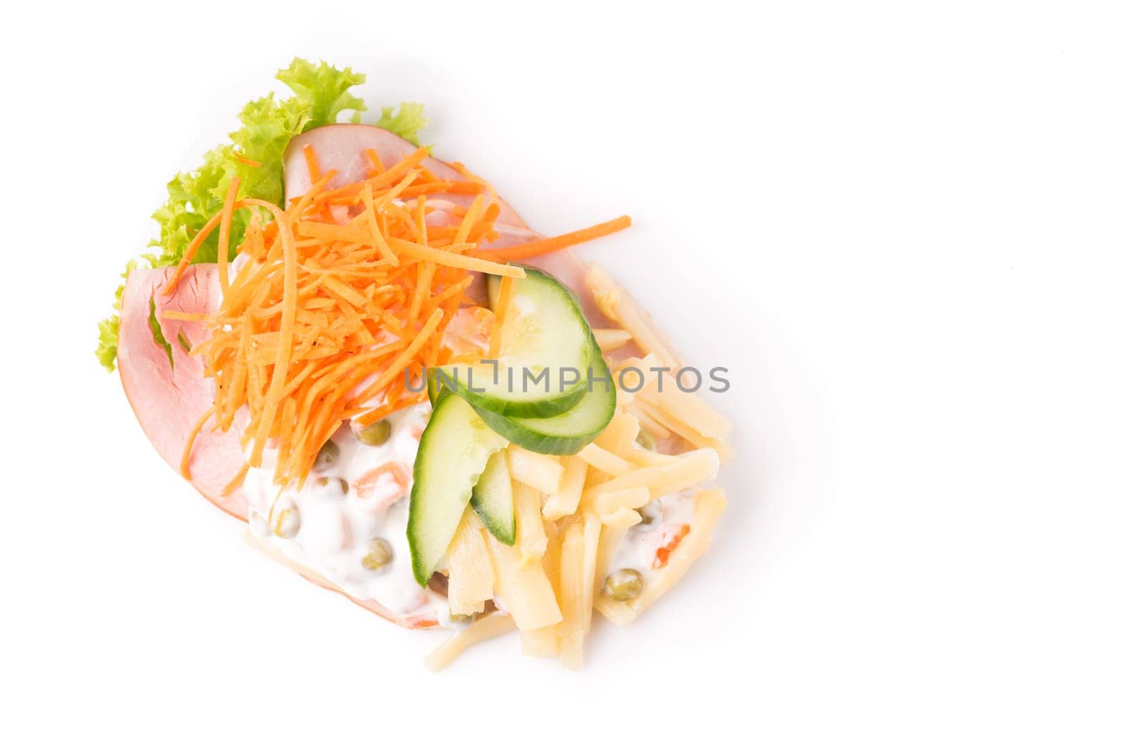Danish specialties and national dishes, high-quality open sandwich. Sandwich with sliced ham, Mayonnaise with green peas and carrot tart, cracked carrots, asparagus and cucumbers