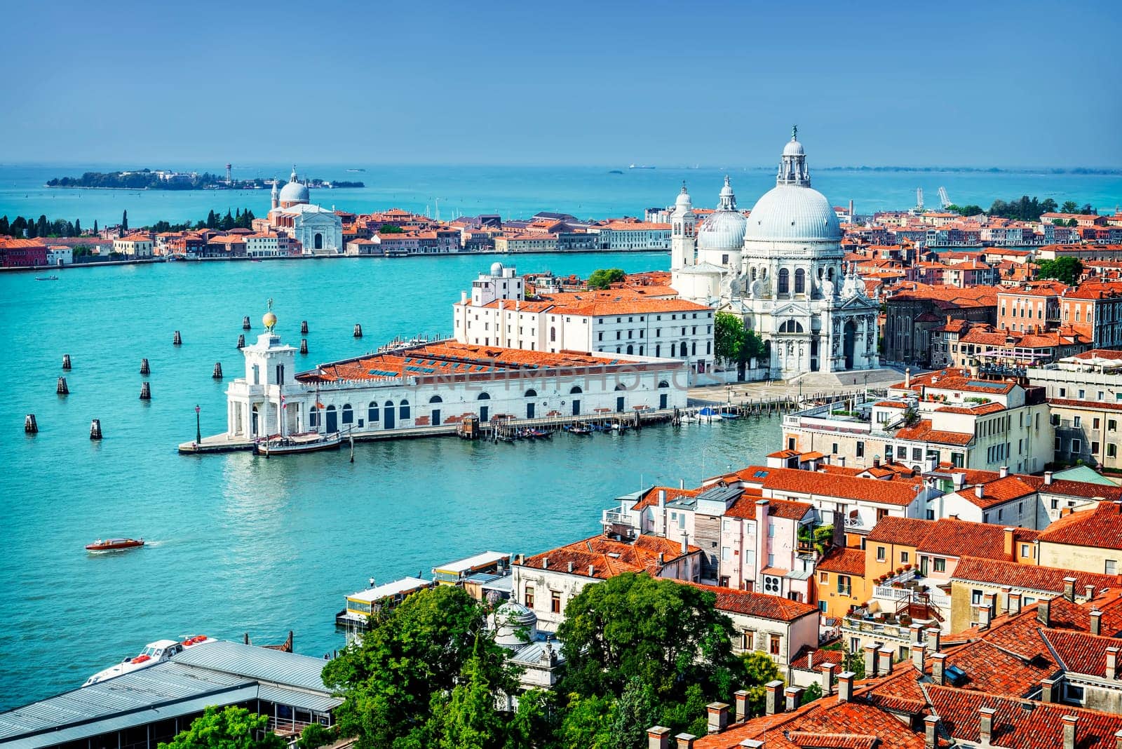 Beautiful view of the Grand Canal and Basilica Santa Maria della Salute in the late evening with very interesting clouds, Venice, Italy