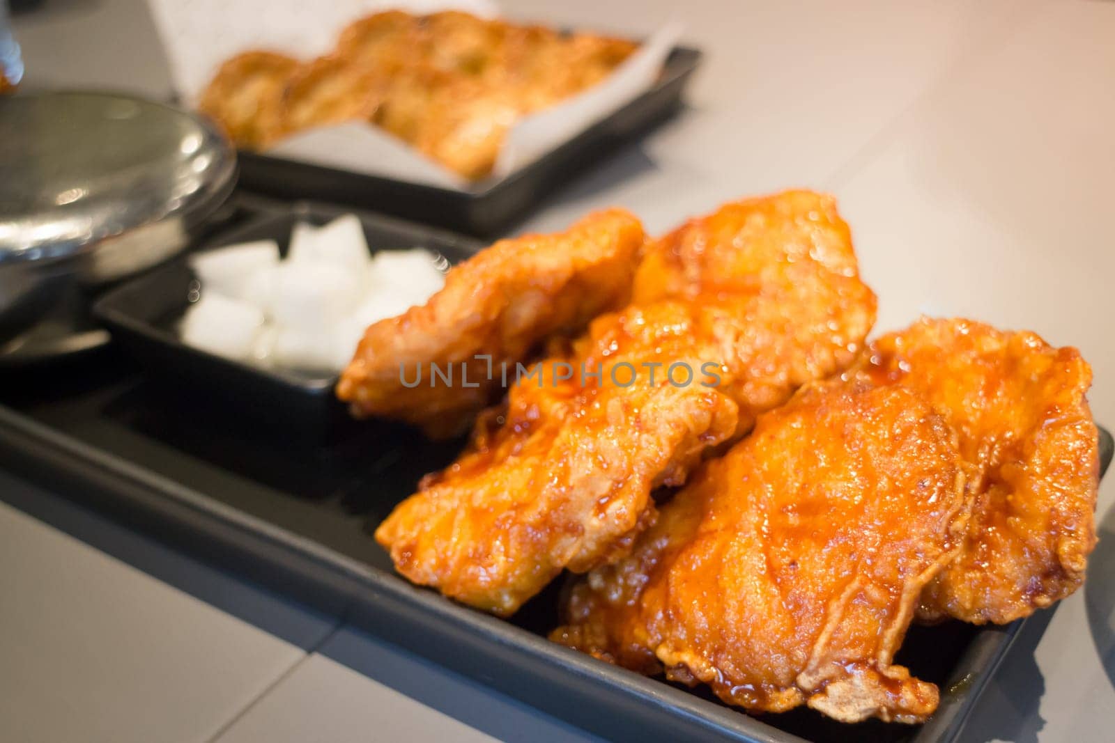 Korean Fried Chicken On Black Plate, stock photo