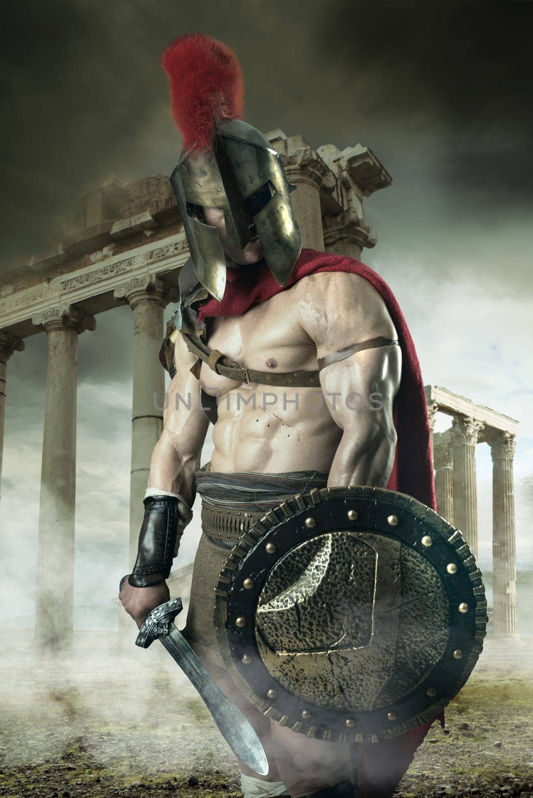 Ancient warrior or Gladiator posing outdoors with helmet