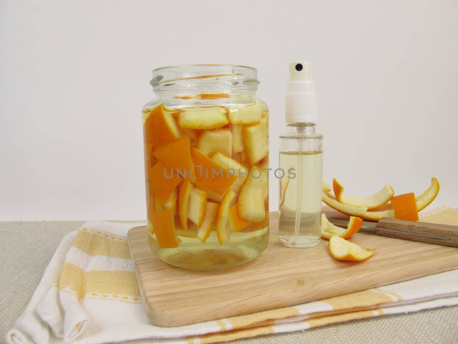 Ecological orange cleaner with orange peel and vinegar in the spray bottle